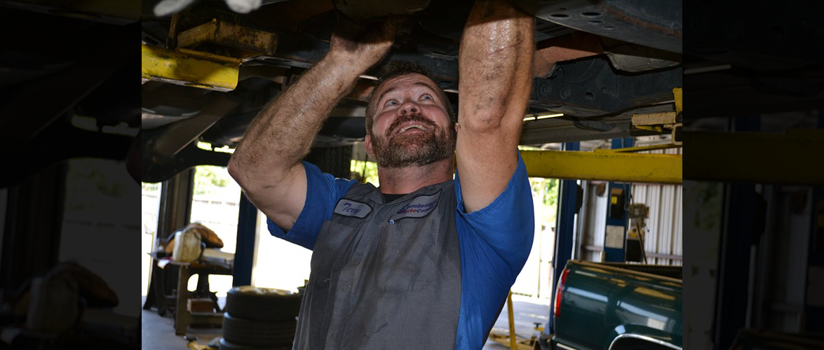 Terry working under a vehicle
